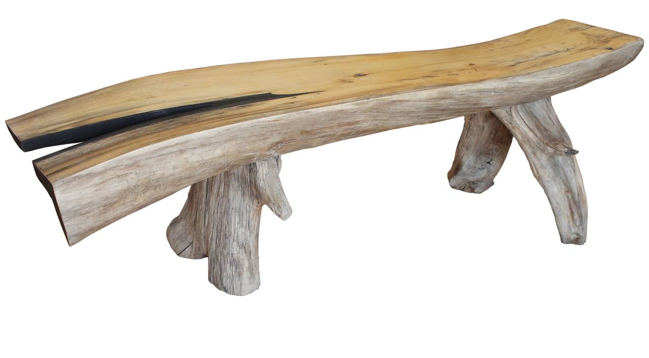 A sculptural, contoured, hand-carved, aged and dried cedar bench on natural legs, with black stripe detail by Brian Ullman.

Dimension: Seat depth 12.5 inches.