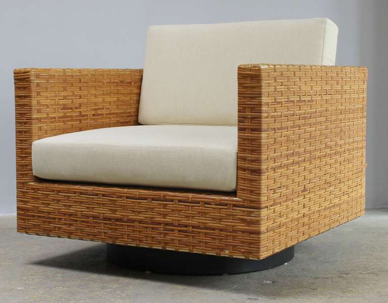 Classic pair Harvey Probber swivel rattan armchairs with new seat and back cushions.