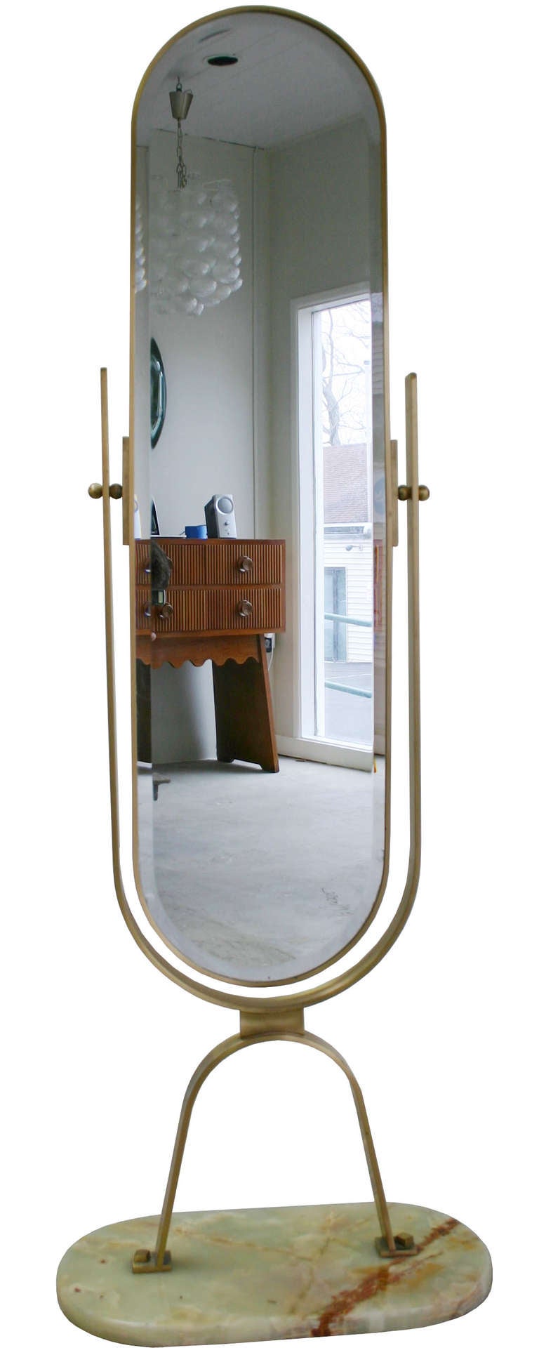 Charming brass frame rotating bevel-edge mirror on alibaster base.
