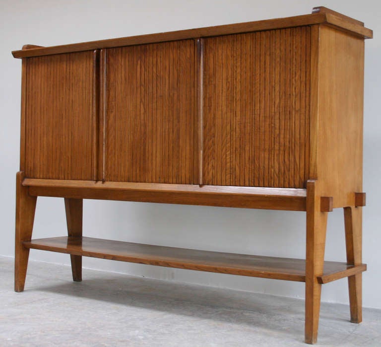 Handsome oak cabinet with shelves and drawers, attributed to Paolo Buffa.