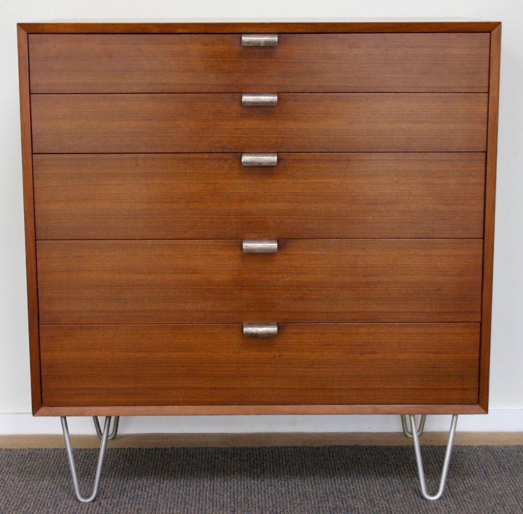 Classic George Nelson walnut dresser with hairpin steel legs and pulls, in vintage original condition.

complementary shipping within 30 miles.