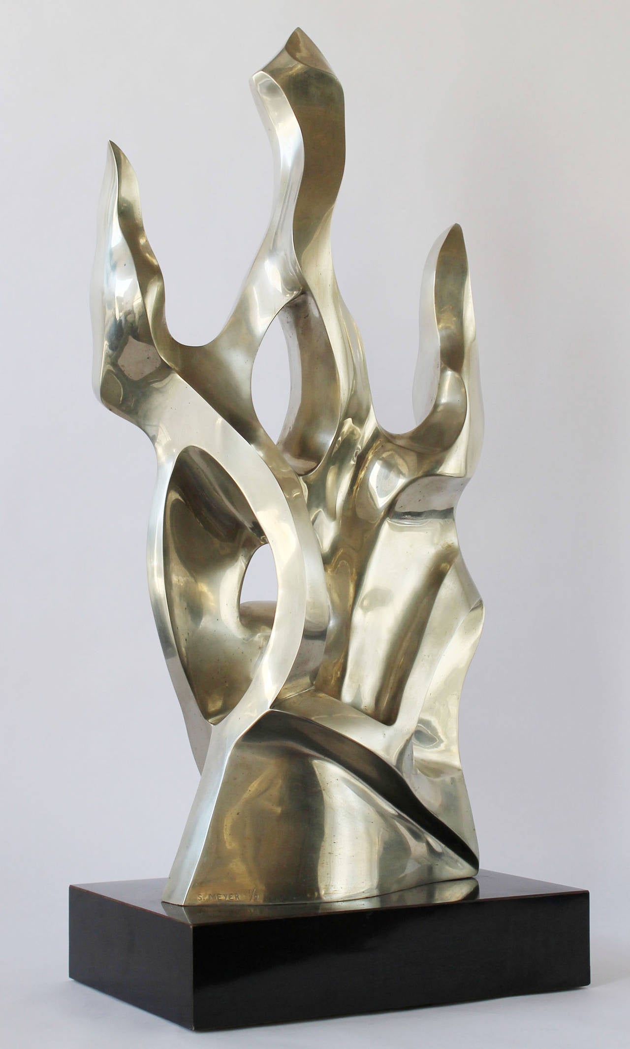 A magnificent solid bronze example of Seymour Meyer's (1914-2009) abstract sculptural forms, mounted on an acrylic swivel base. Signed and labelled; Edition:1/9.
