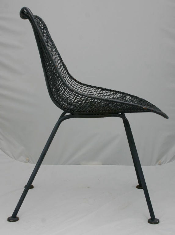 Classic set steel mesh chairs designed by Russel Woodard.