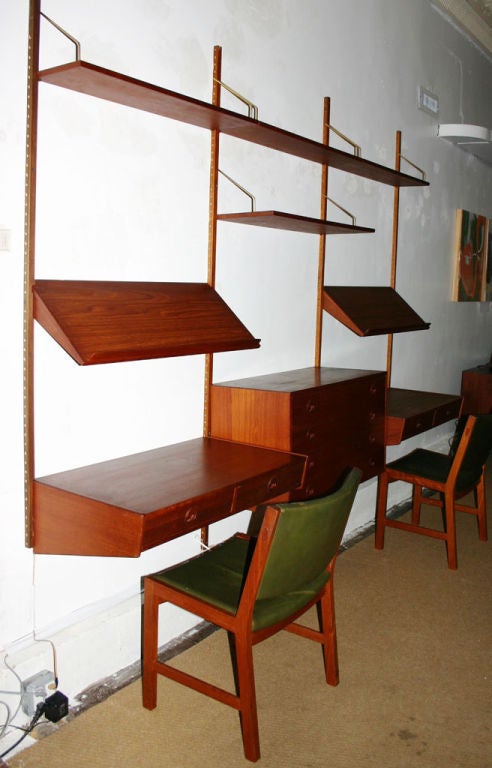 Fabulous teak wall unit with two desks and overhead light/visors that double as book and picture holders; and 4-drawer dresser. 2 more shelves included. Chairs sold separately (4 available -- $450 each).