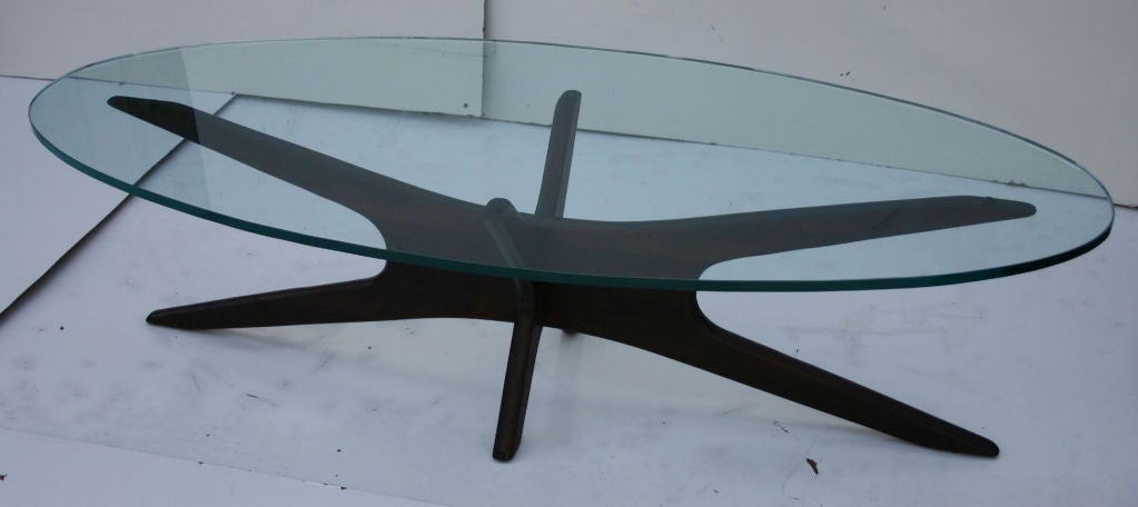 Sculptural and dynamic walnut coffee table with 3/4 in. oval glass, designed by Adrian Pearsall (1925-2011).
