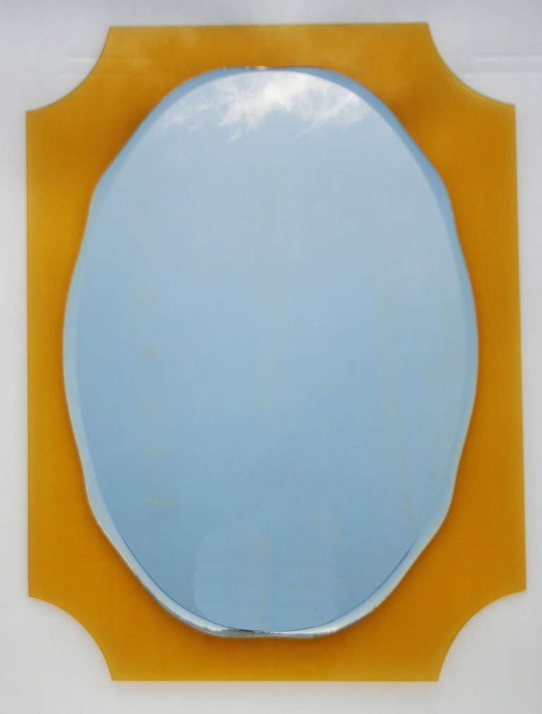 Sunny yellow glass frame with oval bevelled perfect patina mirror.