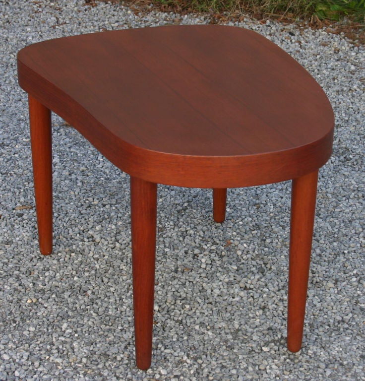Pair biomorphic shape teak end tables designed by Poul Dinesen. Matching coffee table also available (see pictures).