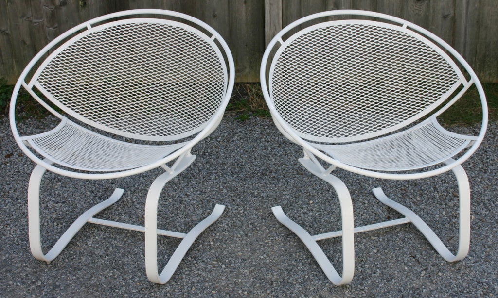 Pair wrought iron and mesh cantilever Chairs by Tempestini for Salterini.