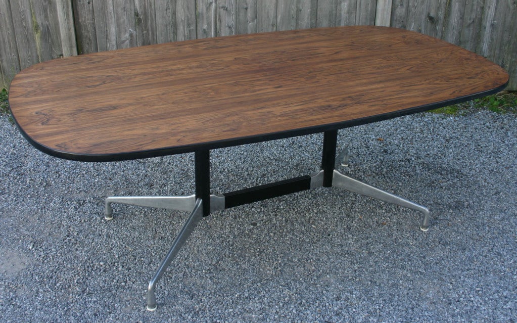 Aluminum Group conference table with rosewood top, designed by Charles Eames for Herman Miller.