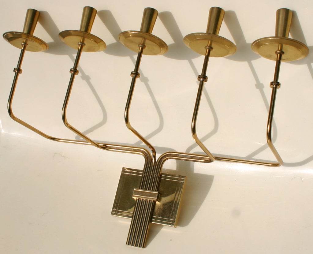 Five candle brass candelabra sconce attributed to Tommi Parzinger.