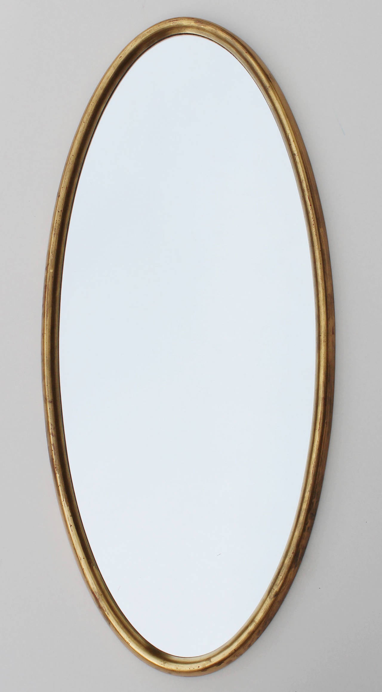 Handsome, deep bevel oval gold leaf wood frame mirror by La Barge