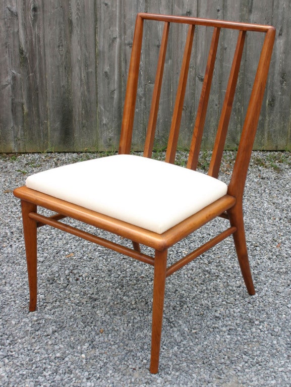 Classic T.H. Robsjohn-Gibbings walnut set of six walnut dining chairs in upholstered in muslin.