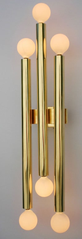 Pair tubular brass sconces by Gio Ponti. polished, rewired and working.
