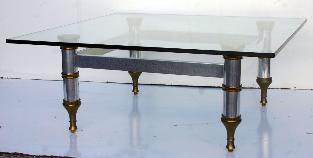 Regency chrome and brass base coffee/cocktail table with 1/2 in. glass top.

base is 30