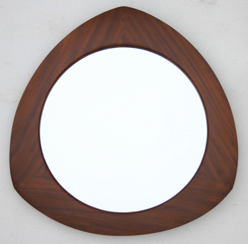 Impeccably crafted teak frame mirror with dovetail joins and bevelling.