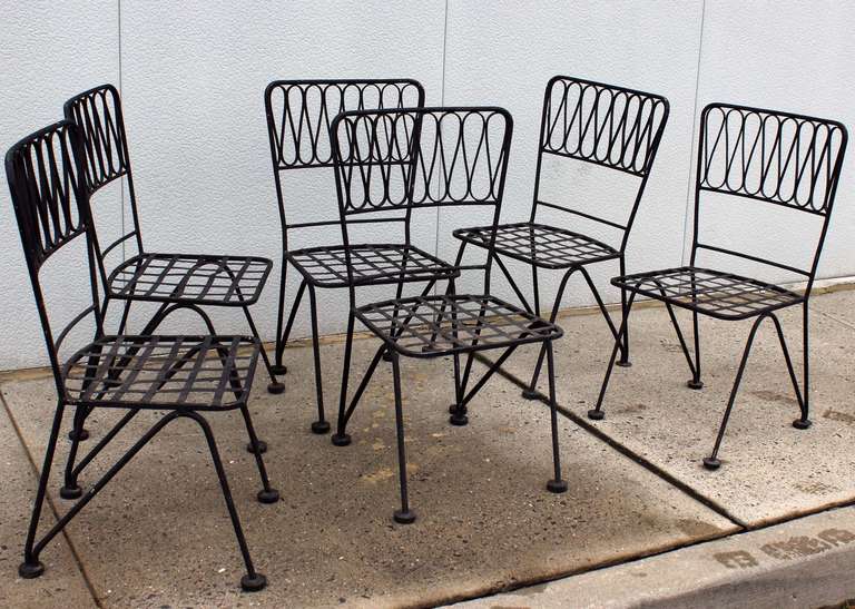 Set of six iron dining chairs by Maurizio Tempestini. Matching table also available -- see pictures.

Possible to do larger glass for table.