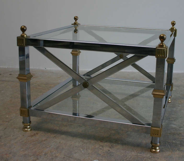 Regency style chrome and brass 2-tier end tables. Matching etagere also available.