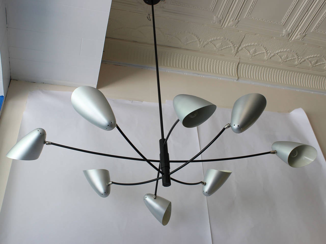 Gorgeous Italian modern-influenced chandelier with brushed metal shades and enameled metal arms and stem, designed by David Weeks.

Local -- Hamptons complementary delivery.