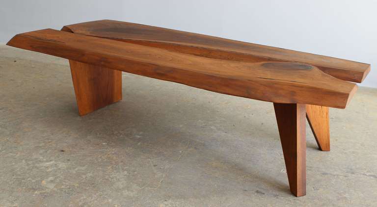 A natural form walnut coffee table in the manner of George Nakashima. From an estate with many Nakashima pieces.