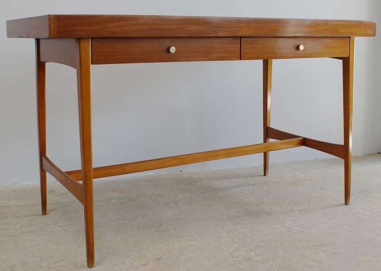 Modern Italian wood writing table with two drawers and polished brass hardware.