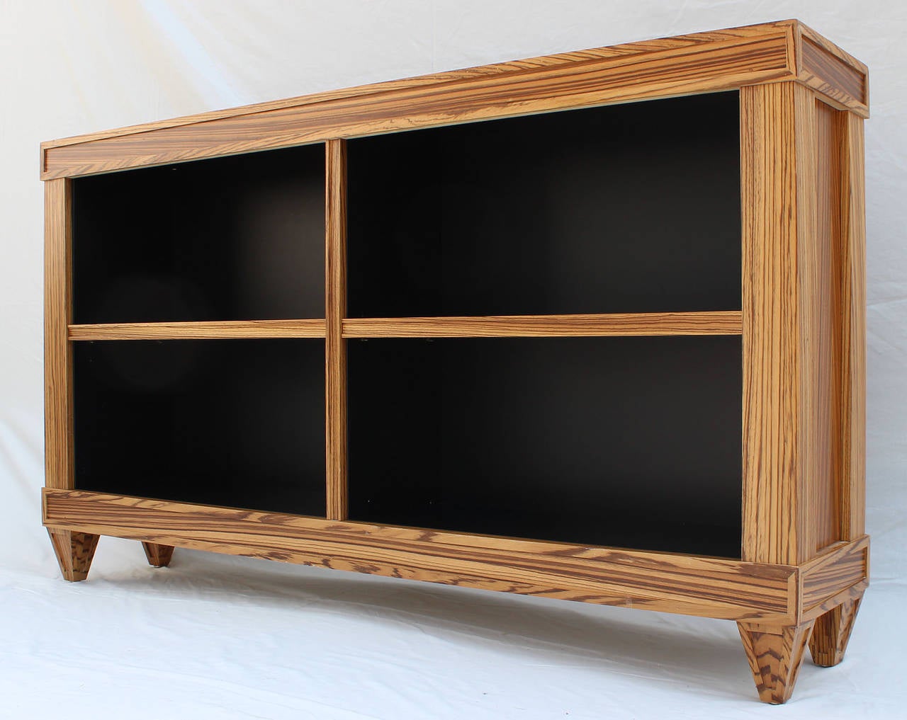 Magnificent post-modern, custom-made zebrawood bookshelves with black interior. Three available.

Complimentary shipping to Hamptons.