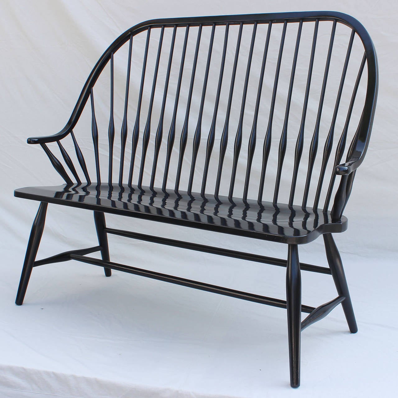 A Windsor style, high-back, black lacquered bench.

Complimentary shipping within Hamptons.