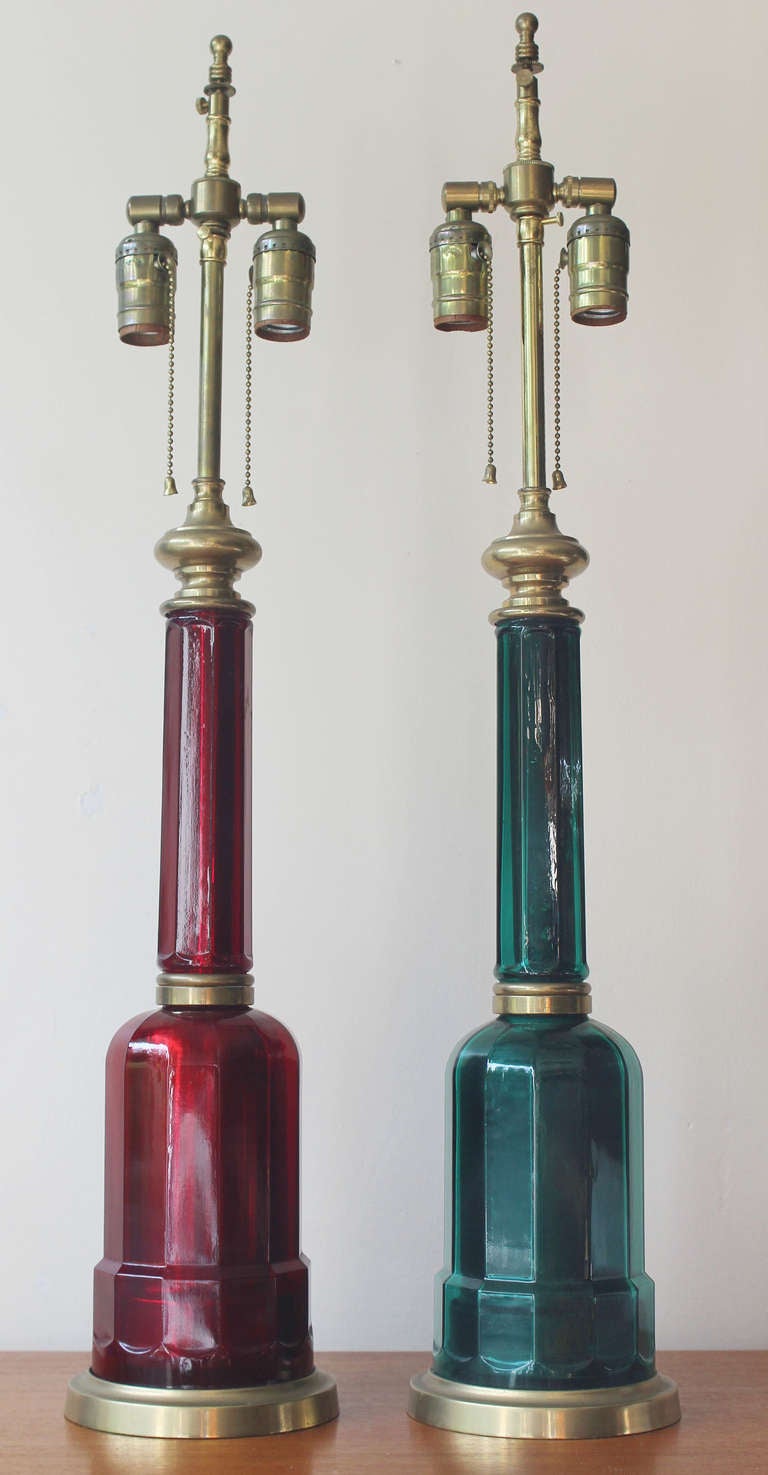 Pair Italian regency style red and green glass lamps with patinaed brass details.