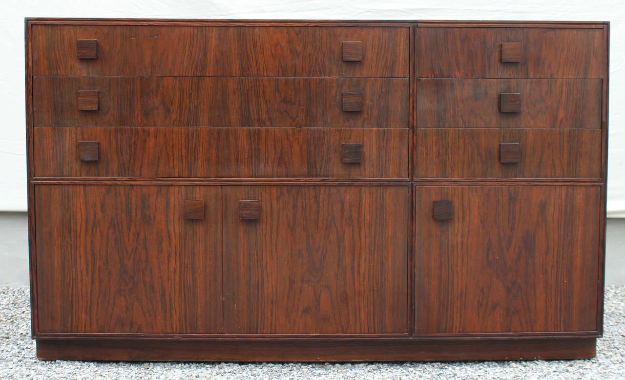 A rosewood dresser with drawers and cabinets and mirrored vanity, designed by Gianfranco Frattini for Bernini.

Complimentary shipping within Hamptons.