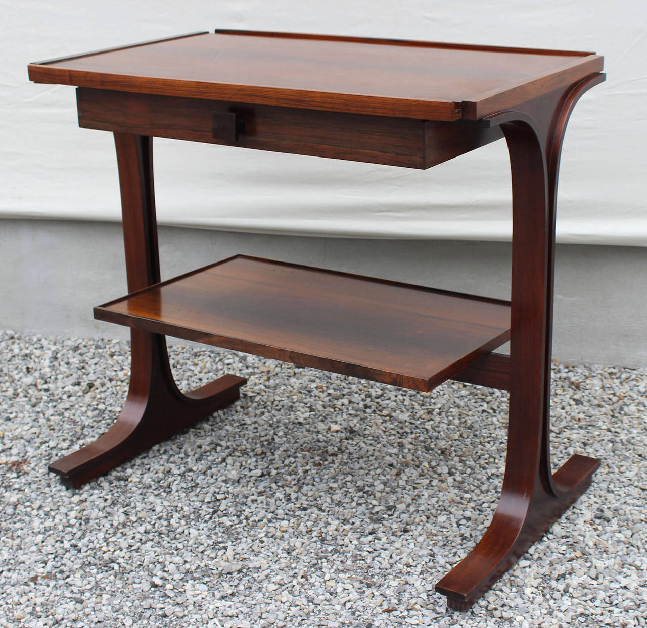 A rosewood writing or side table with drawer designed by Gianfranco Frattini for Bernini.

complimentary delivery within Hamptons.