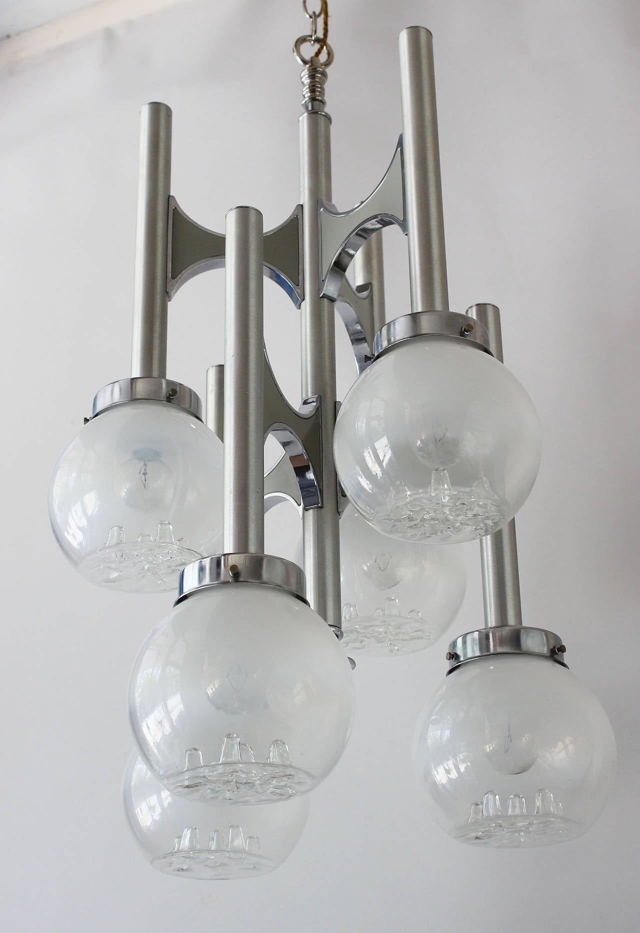 A two textured chrome chandelier with blown glass globes, designed by Gaetano Sciolari.