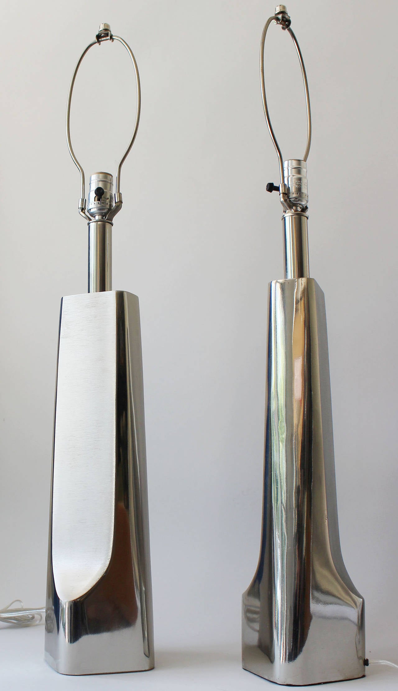 A pair of two-textured chrome Laurel lamps manufactured by Laurel Lamp Co.

Height to bottom of socket 22.5