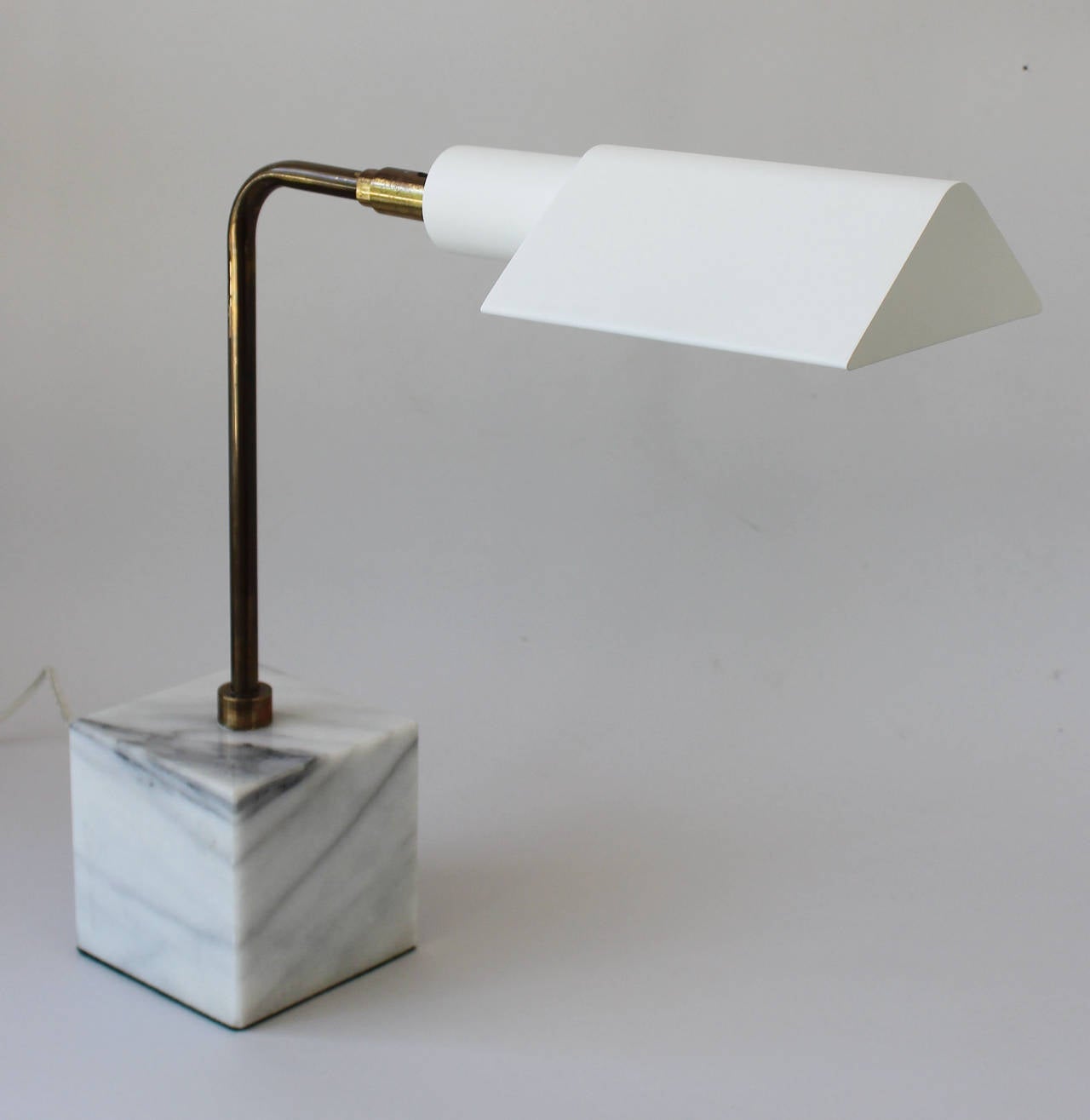 A patinaed brass and powder coated aluminum articulating desk lamp with marble base by Koch and Lowy.

complementary delivery within 30 miles.