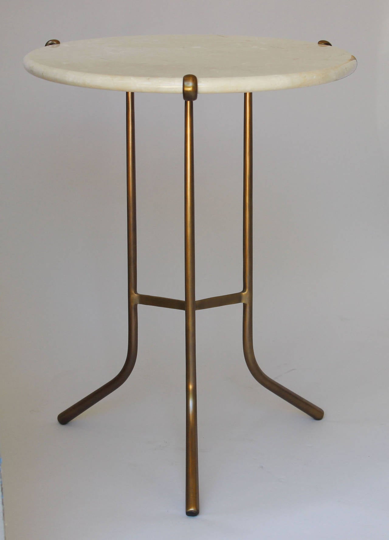 A Cedric Hartman style bronzetone metal base side table with travertine top.

complementary delivery within 30 miles.
