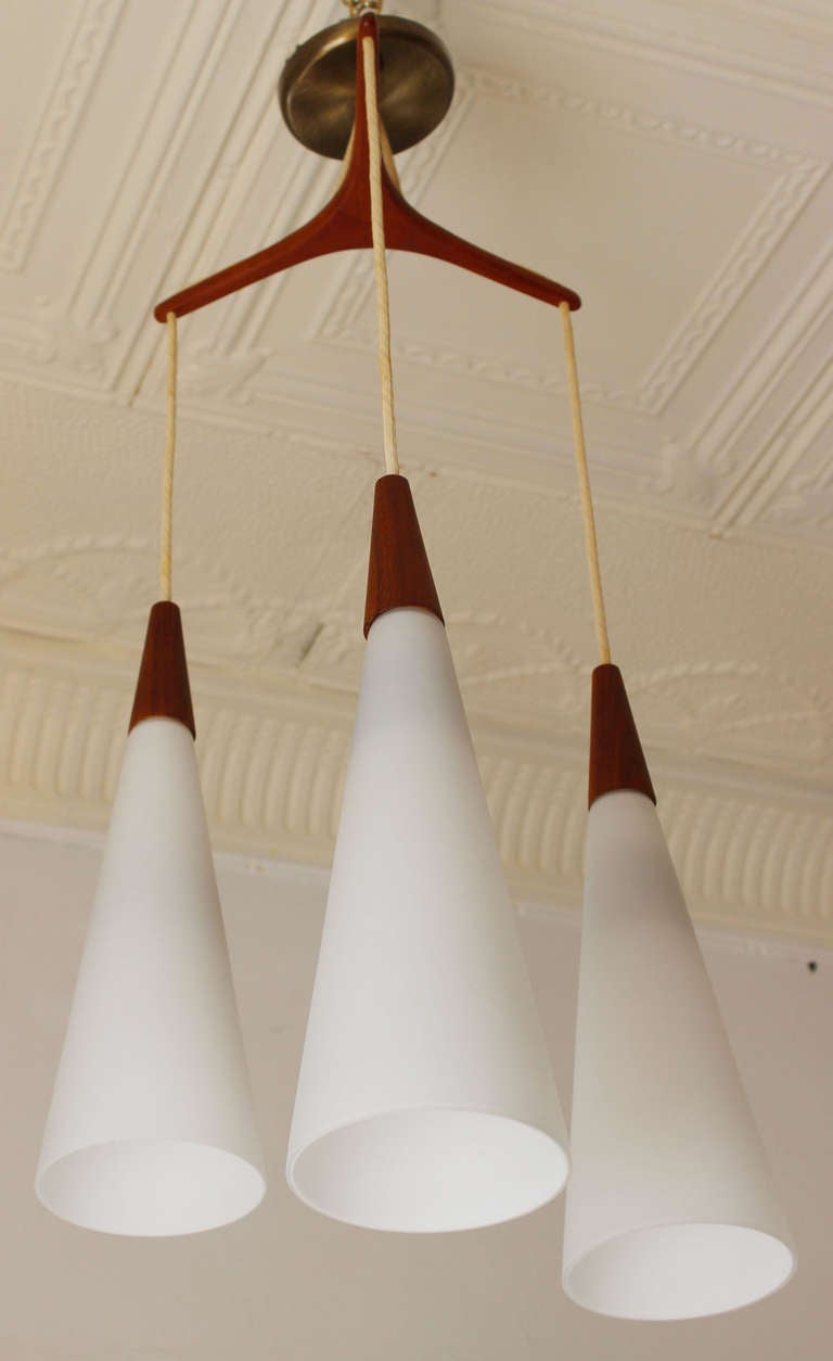 Teak and milk glass tripod Danish pendant by Holm Sorensen.