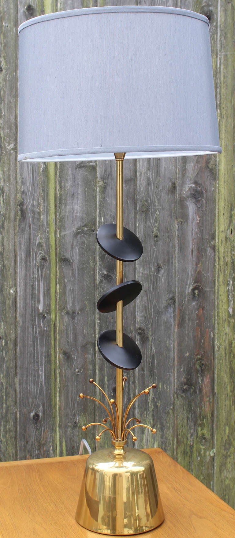 Pair Rembrandt warm brass table lamps with black disk  and brass details in the style of Paavo Tynell.

shades for photo only.