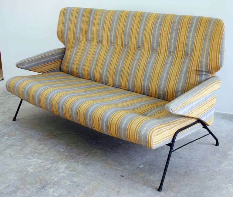 Modern and sculptural steel base sofa in vintage original upholstery.