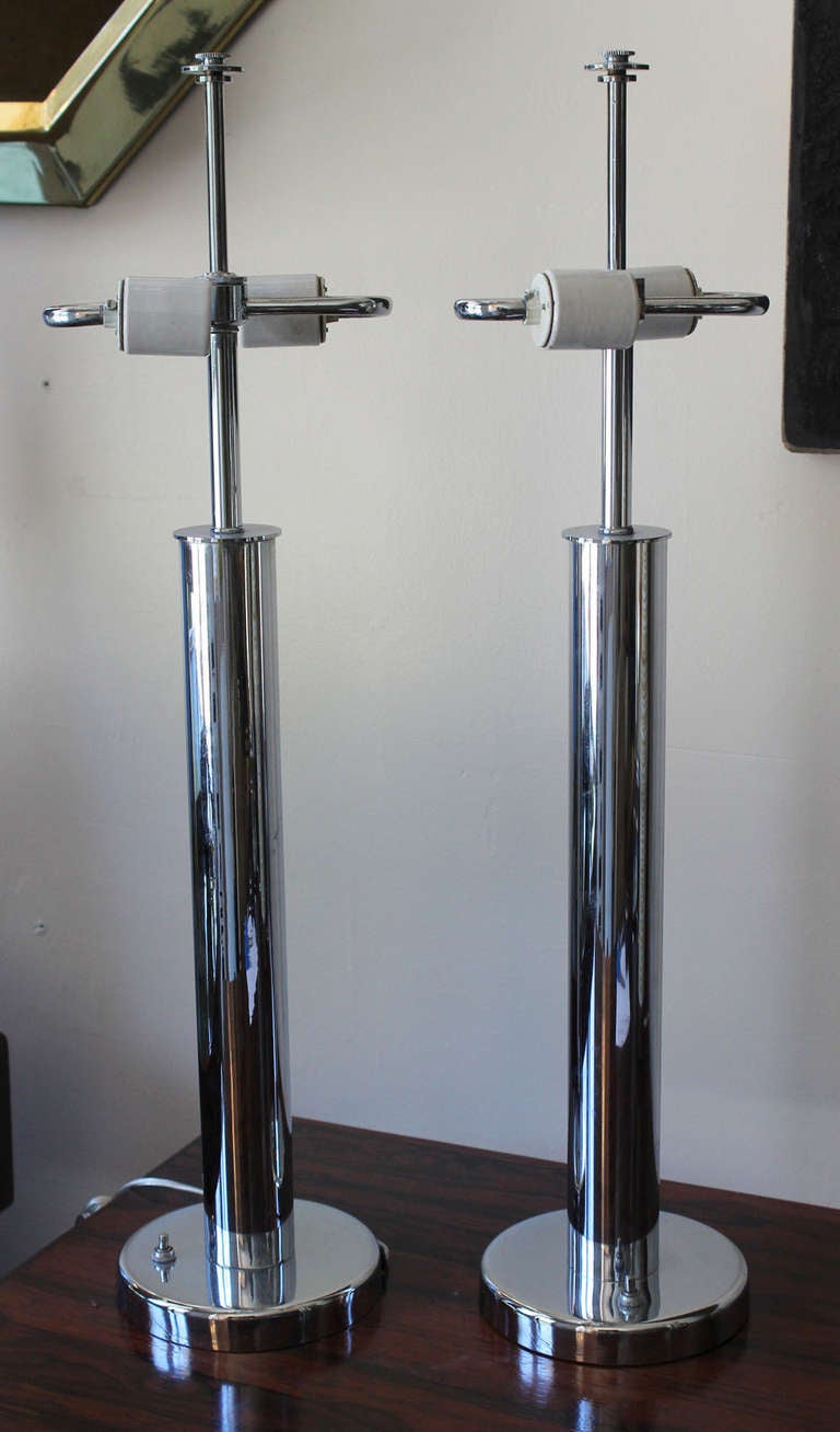 Classic pair of Nessen lamps in chrome with dual porcelain sockets. signed.

shades for photo only.