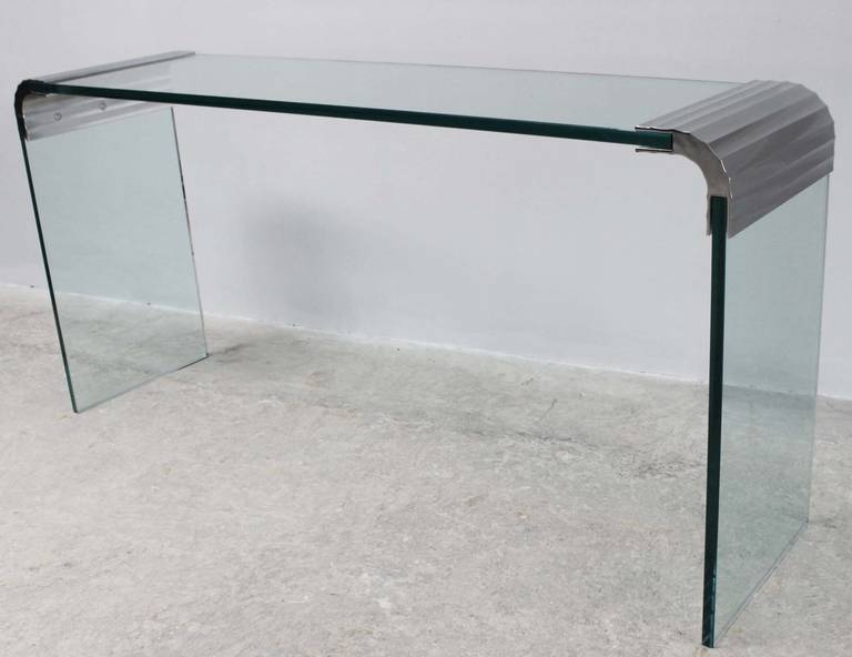 A Pace Collection 3/4 inch thick glass console with ribbed, nickel-plated join hardware.