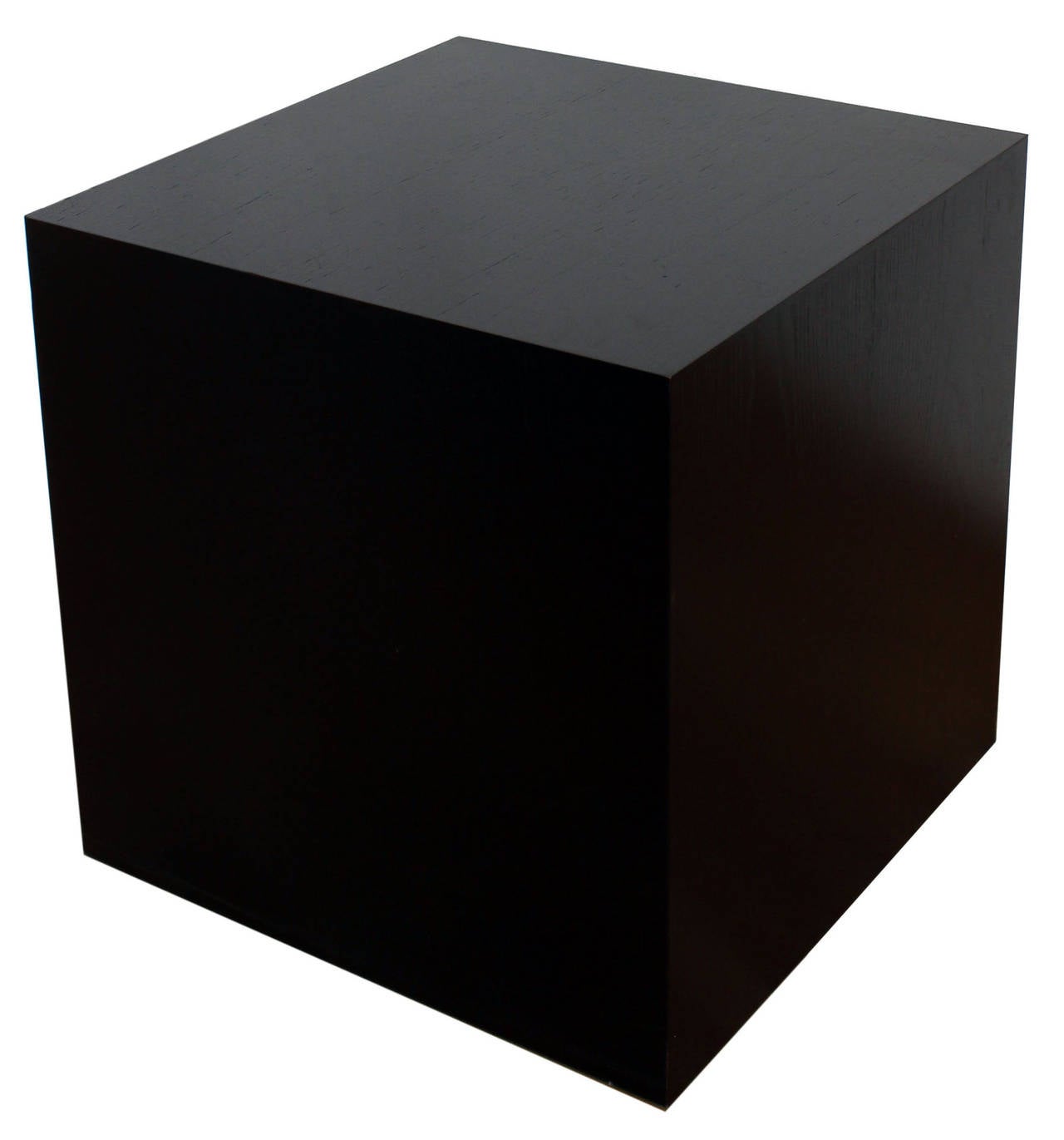 A pair of black oak cubes on casters, with visible wood grain, designed by British architect Max Gordon, and inspired by sculptor Donald Judd. Made by James Cooper of Moon Cabinet, NYC.

complimentary shipping within 30 miles.