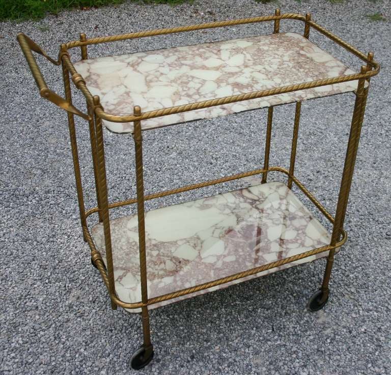 Brass rope bar or tea cart server with eglomise style faux marble painted glass. On casters.