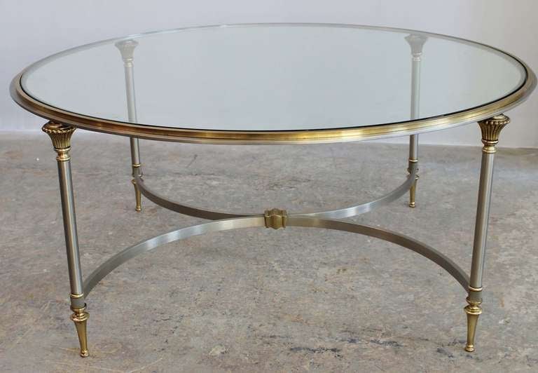 Brass and brushed chrome regency style coffee table with glass top, attributed to Maison Jansen.