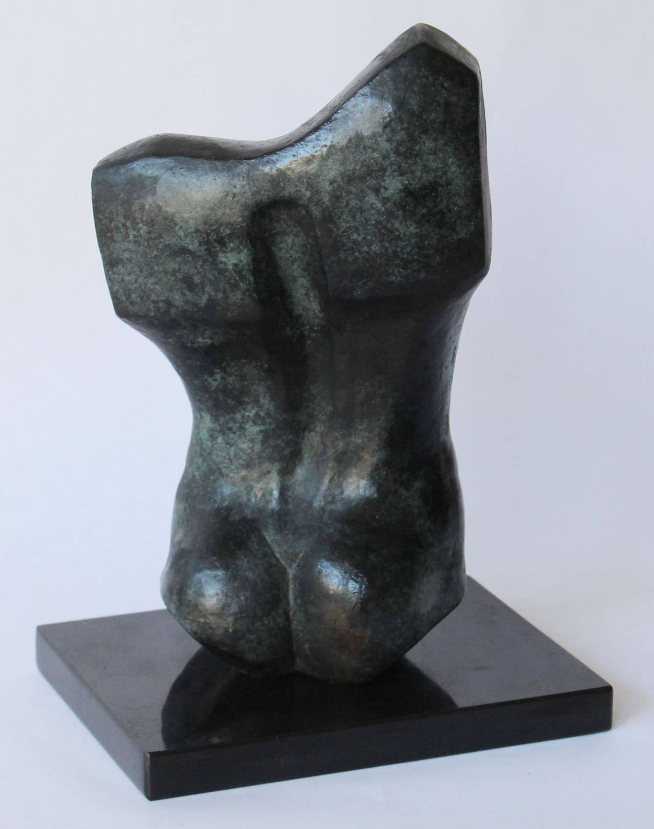 Patinaed cast bronze torso on stone base, by Thomas Ogle (b Finland (1938-).

Complementary shipping within 30 miles.