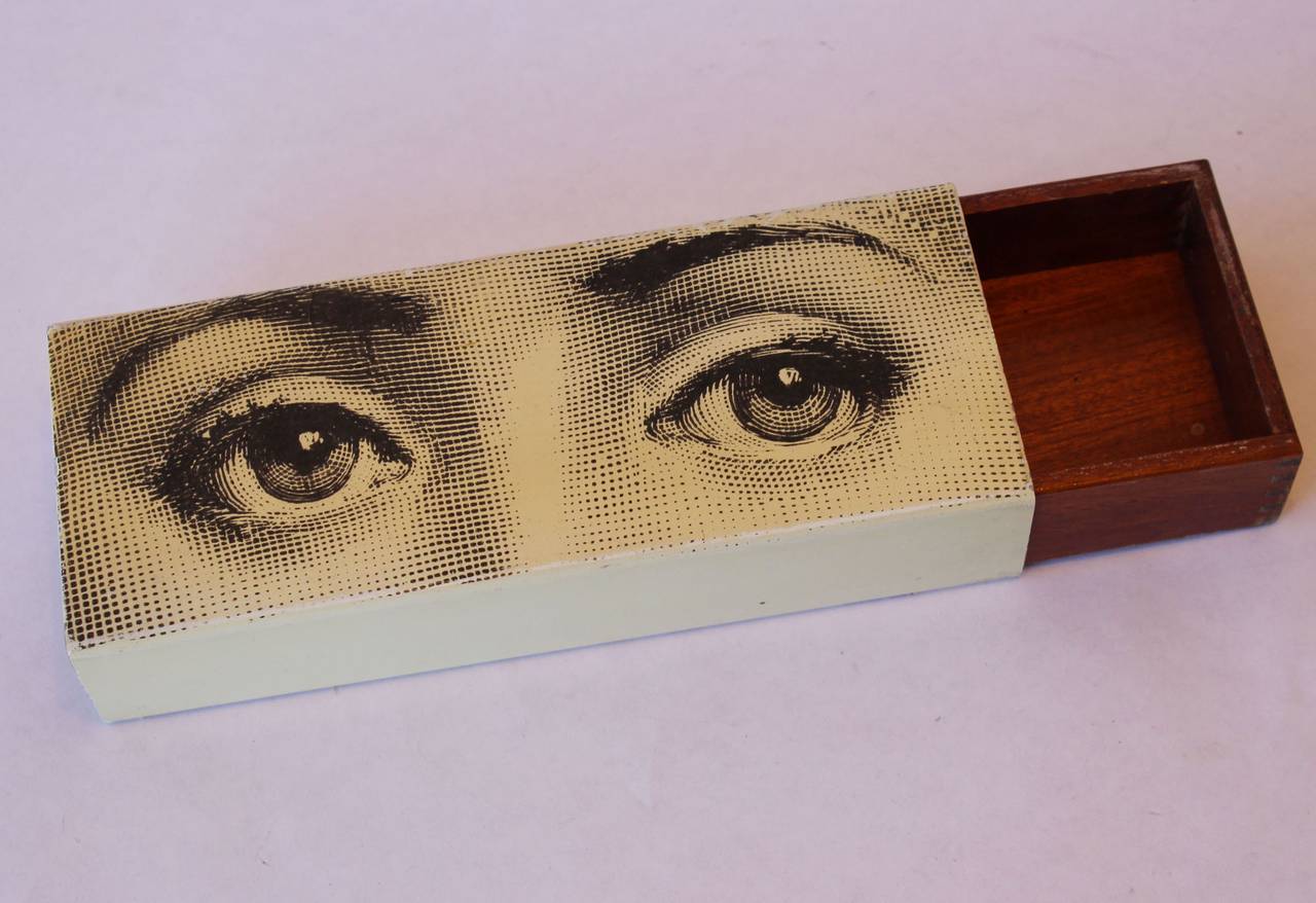 A classic, enameled photo-litho on enameled metal box with interior sliding wood drawer, by Piero Fornasetti.