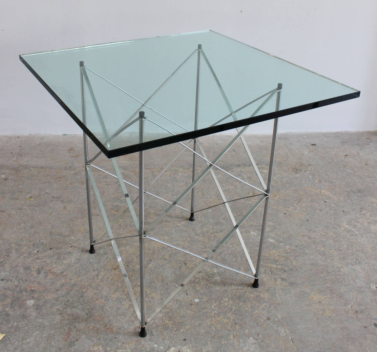 A 1970's Pace Collection chrome scaffold dining or game table with 1/2 inch glass top.