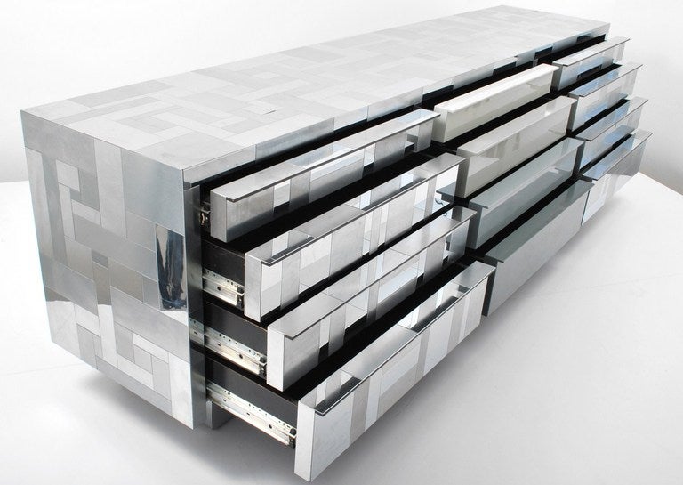 A 9 Ft Chrome Patchwork Cityscape Cabinet/Credenza by Paul Evans for Directional, USA, 1970. Part of the Cityscape series for Directional, this polished chrome console features 12 pull-out drawers. The base is recessed giving a floating appearance