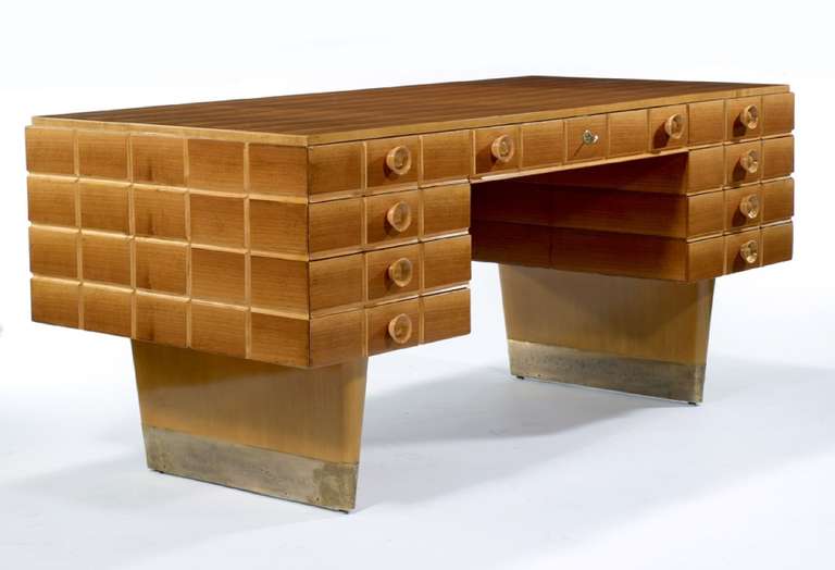 Executive Desk by Gio Ponti, Italy, ca. 1938. An executive desk masterfully designed and crafted using Aniegre wood, a species of African Mahagony, for the top and front and European Maple wood feet capped in bronze. The desk consists of panelled
