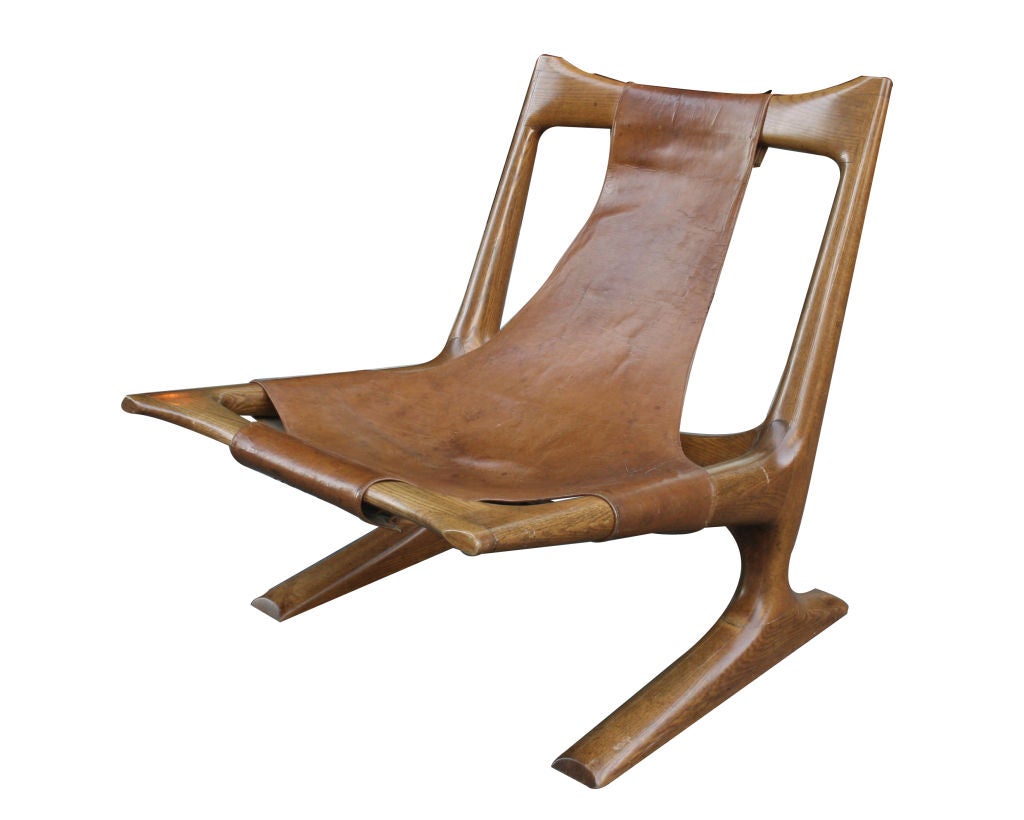 Carved Oak and Leather Lounge Chair by J. Muckey