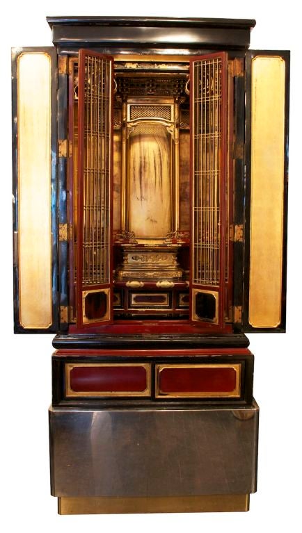 A 1920's Japanese shrine, possibly Buddhist, custom-mounted by Karl Springer Ltd. as an object of vertu on a polished steel and bronze trimed platform base. The shrine circa 1920s in black laquer and cinnebar with gold leaf decoration throughout. In