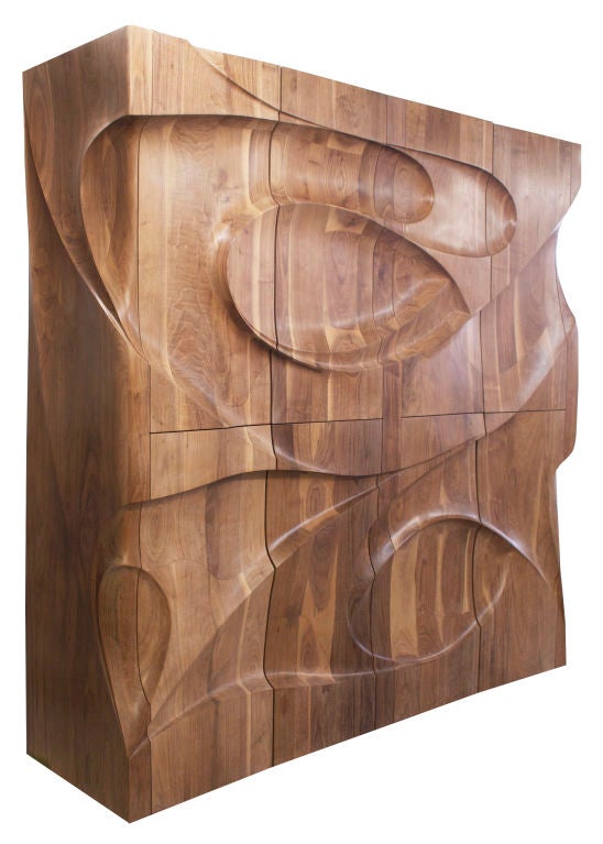 A monumental eight-door standing cabinet in American Black Walnut designed and hand-carved by Michael Coffey. This outstanding piece of sculptural furniture may be the masterpiece of artist Michael Coffey's oeuvre. This is the largest