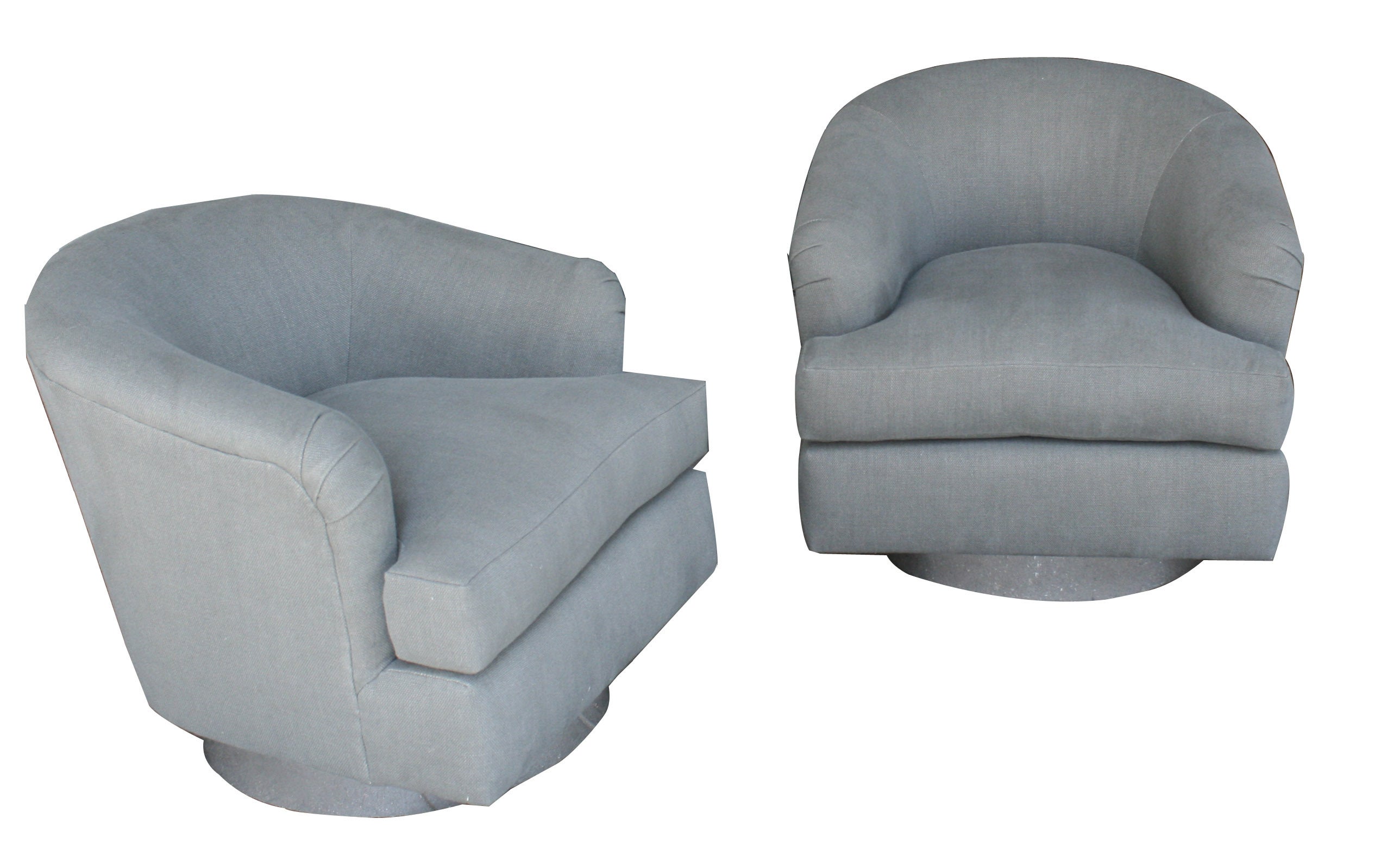 A Pair of Swivel Chairs in Linen by Milo Baughman, USA, ca. 1970s.